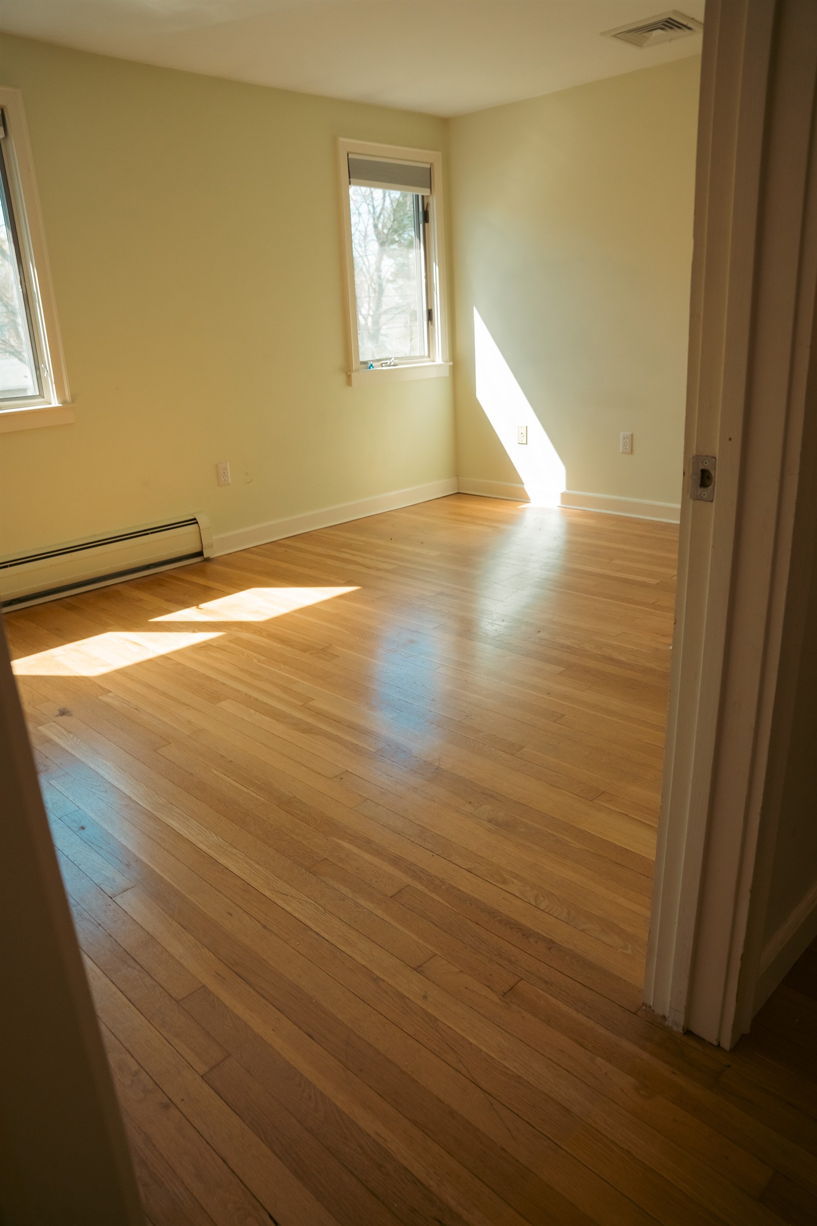 Refinished floor in a bright bedroom
