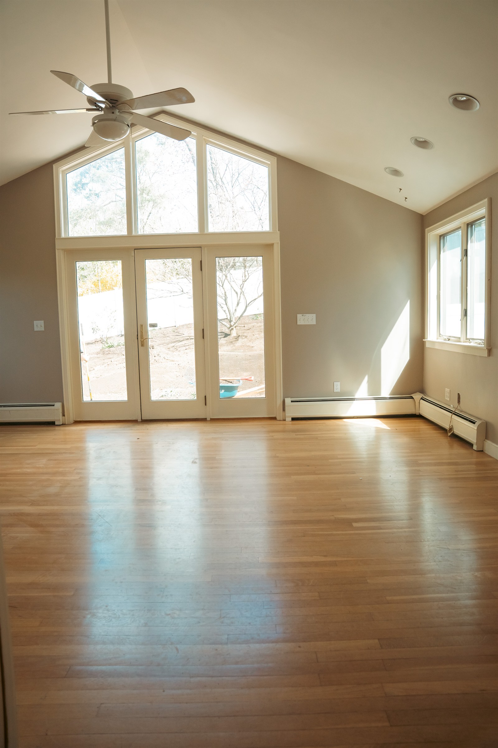 Refinished hardwood in a vaulted room